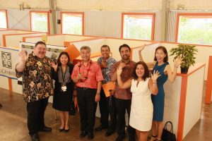Gov. Ige, DHS director Pankaj Bhanot and state homelessness coordinator Scott Morishige with staff at the new Family Assessment Center in Kaka'ako.