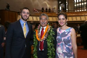 Governor Ige with Shaka Tea owners Harrison Rice and Bella Hughes in the House chamber.