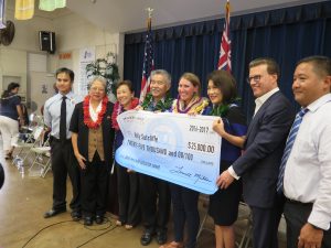 MILKEN WINNERS: Kelly Sutcliffe stands with Gov. Ige and the first lady, superintendent Kathy Matayoshi, Lowell Milken and others from Jefferson Elementary School.