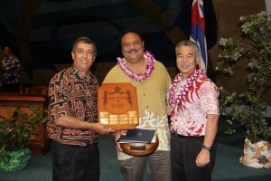 Top manager: Mark Patterson with DHS director Pankaj Bhanot and Gov. Ige.