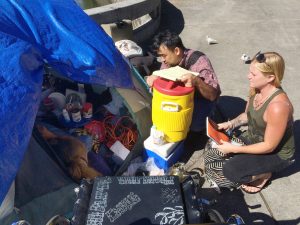 REACHING OUT: Homelessness coordinator Scott Morishige works with Nicole Bieneman of the CHOW project near Chinatown to help homeless individuals.