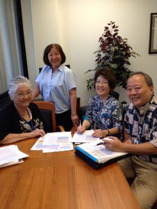 WORKFORCE TEAM: DLIR director Linda Chu Takayama (standing) with Elaine Young, Carol Kanayama and Jay Ishibashi.