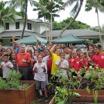 Gov. Ige and Blanche Pope Elementary students helping in the Washington Place garden