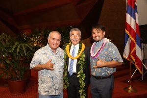 Gov. Ige congratulates Hawai'i Island farmer Richard Ha and Smart Yields CEO Vincent Kimura on their efforts to increase local food production.