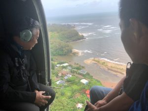 The governor surveys flood damage in Hanalei by helicopter. Gov. Ige made available millions in state funds and is taking steps to secure federal disaster relief.
