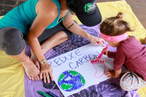 A mom and her daughter send their own message about the Earth reducing its carbon footprint.