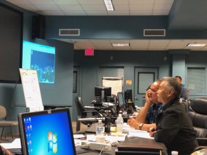 Mayor Carvalho and Governor Ige at a video teleconference on storm damage.