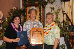 State Manager of the Year JoAnn Vidinhar and Director Leonard Hoshijo of DLIR with the governor.