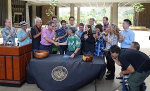 PROTECTING REEFS: Gov. Ige and legislators gather at the Capitol for the historic bill signing.