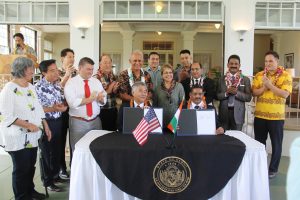 Gov. Ige and Gurudas Pilarnekar, Goa's art and culture director, make history by signing sister-state agreement.