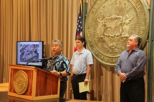 Gov. Ige describes the need to replace OCCC at a press conference with Rod Becker (left), director of the Department of Accounting and General Services and Nolan Espinda, director of the Department of Public Safety.