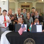 Gov. Ige and Gurudas Pilarnekar, Goa's art and culture director, make history by signing sister-state agreement.