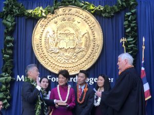 As his family looks on, Governor Ige is sworn in by Chief Justice Mark Recktenwald.