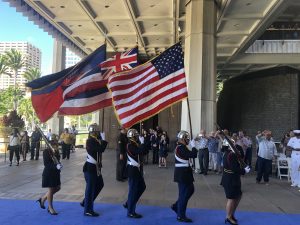 Members of the Waipahu High ROTC bearing flags.