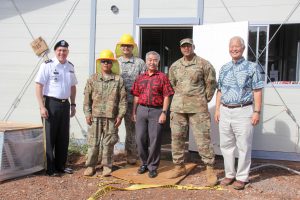 Governor Ige with members of the Hawai'i National Guard, Maj. Gen. Joe Logan and project developer Mel Kaneshige at Kahauike Village.