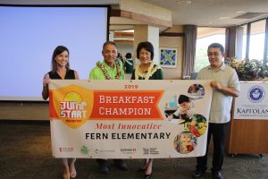 Fern Elementary principal Glen Miyasato (center) accepts the award for "Most Innovative" breakfast program from Mrs. Ige, Daniela Kittinger of Hawai'i Appleseed and Dexter Kishida of the DOE.