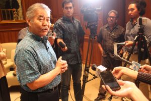 Gov. Ige fields questions from reporters on budget funding.
