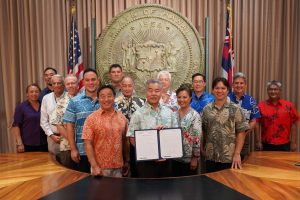 Governor Ige, legislators, UH and stadium officials gather for the signing of Act 268, appropriating construction funds as part of a New Aloha Stadium Entertainment District.