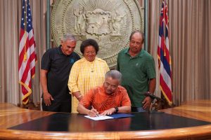 Gov. Ige with Hawaiian Homes Commission chair William Aila, Jr. and commissioners Pauline Namuo (O'ahu) and Zachary Helm (Moloka'i).