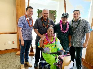 DHHL director William Aila, Jr. with beneficiary Nani Kinimaka Davis and her ‘ohana, joined by Tyler Gomes and Rep. Ty Cullen. She accepted a lot in DHHL’s Ka‘uluokaha‘i project in Kapolei.