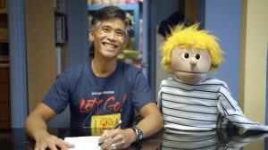 HTY company actor Junior Tesoro and a puppet friend welcome viewers to the new online series “The HI Way.”