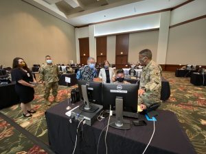 Governor Ige, Chief of Staff Linda Takayama with National Guard contact tracers. At far left, DOH branch chief Dr. Emily Roberson and HI-EMA director Kenneth Hara.