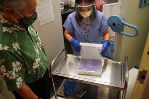 Governor Ige inspects the first shipment of COVID-19 vaccines at The Queen’s Medical Center last month. The initial delivery from Pfizer-BioNTech marked a major milestone for Hawai‘i in the ongoing effort to combat COVID-19 and return life to normal.