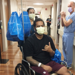 Alofa Nua throws a shaka as he leaves the hospital.