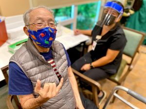 Happy seniors like Walter at The Plaza Moanalua are being vaccinated.