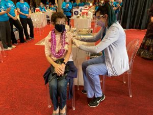 Caroline Limm, 91, was the first person to be vaccinated at Queen’s Blaisdell site. Photo credit: Queen’s Health Systems