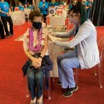 Caroline Limm, 91, was the first person to be vaccinated at Queen’s Blaisdell site. Photo credit: Queen’s Health Systems