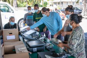 The Kuauli team prepares computers for Hilo distribution.