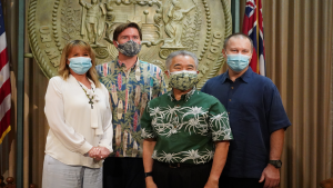 The Anderson family from Waioli Kitchen and Bake Shop with Governor Ige after the bill signing.