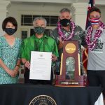 Governor Ige and the First Lady, coach Charlie Wade and team captain Colton Cowell with the NCAA trophy and proclamation.