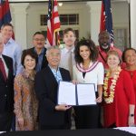 Chief Justice Mark Recktenwald, the Iges and other officials celebrate with Miss Hawai‘i USA 2020 Samantha Neyland.