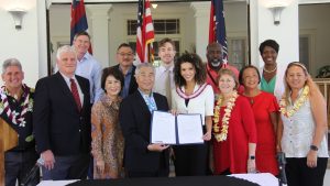 Chief Justice Mark Recktenwald, the Iges and other officials celebrate with Miss Hawai‘i USA 2020 Samantha Neyland.