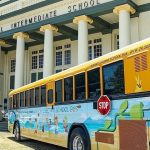 State officials, community partners and c lean energy advocates gathered on the steps of Central Middle School to celebrate the new laws.