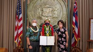 Governor and Mrs. Ige honor Olympic gold medal winner and surfing champion Carissa Moore.