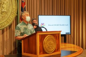 Governor Ige at podium announcing Hawaii SMART Health Card