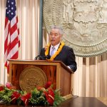 Governor Ige speaking at a podium at state of the state