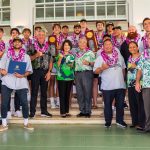 Governor and Mrs. Ige with the winning UH Rainbow Warriors and coaching staff.