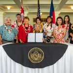 Governor and Mrs. Ige with students, legislators and other advocates for SB 2821.