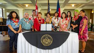 Governor and Mrs. Ige with students, legislators and other advocates for SB 2821.
